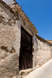 Old wall and door, Alhama de Granada, Andalusia, Spain photo
