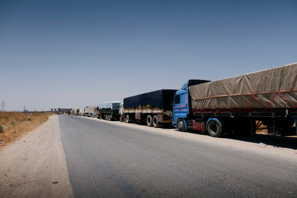 Views of a line of trucks from Arab cities in Iraq, waiting to enter the grain depot in Sinjar 01