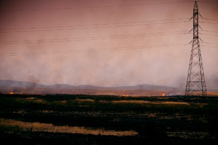 View at sunset of the smokey skyline in Sinjar during the 2019 fires that ravaged the region - 12