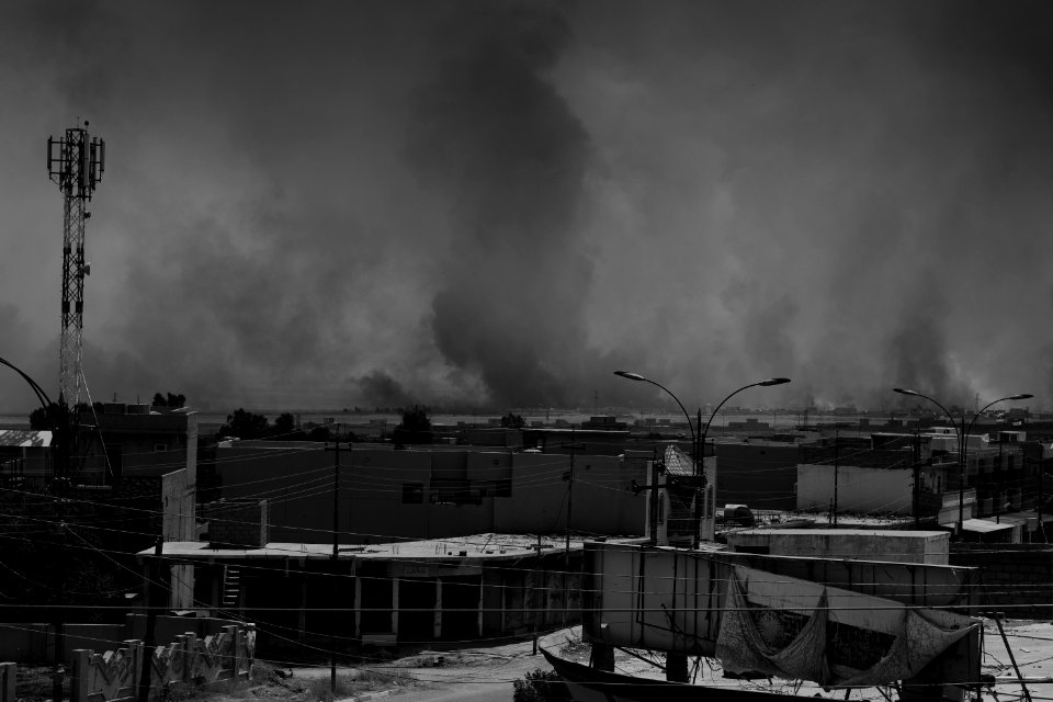 Views on 28th June 2019 around the destroyed city center of Shingal while a field fire rages south of the city 15