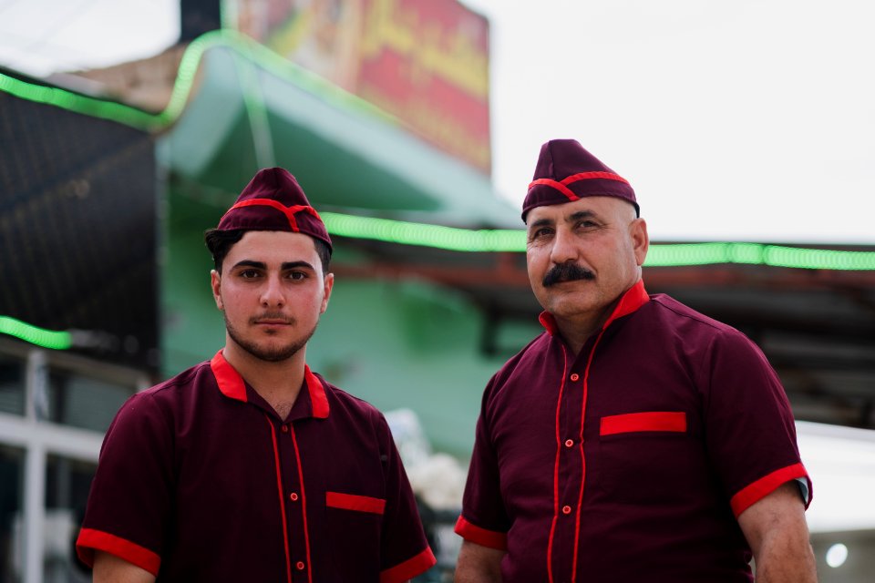 Views of the owner and his son of a recently reopened restaurant in Shingal, following war with the Islamic State 10