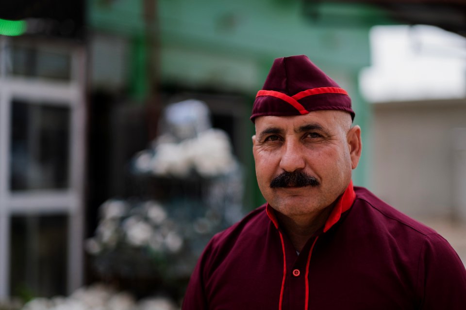 Views of the owner and his son of a recently reopened restaurant in Shingal, following war with the Islamic State 04