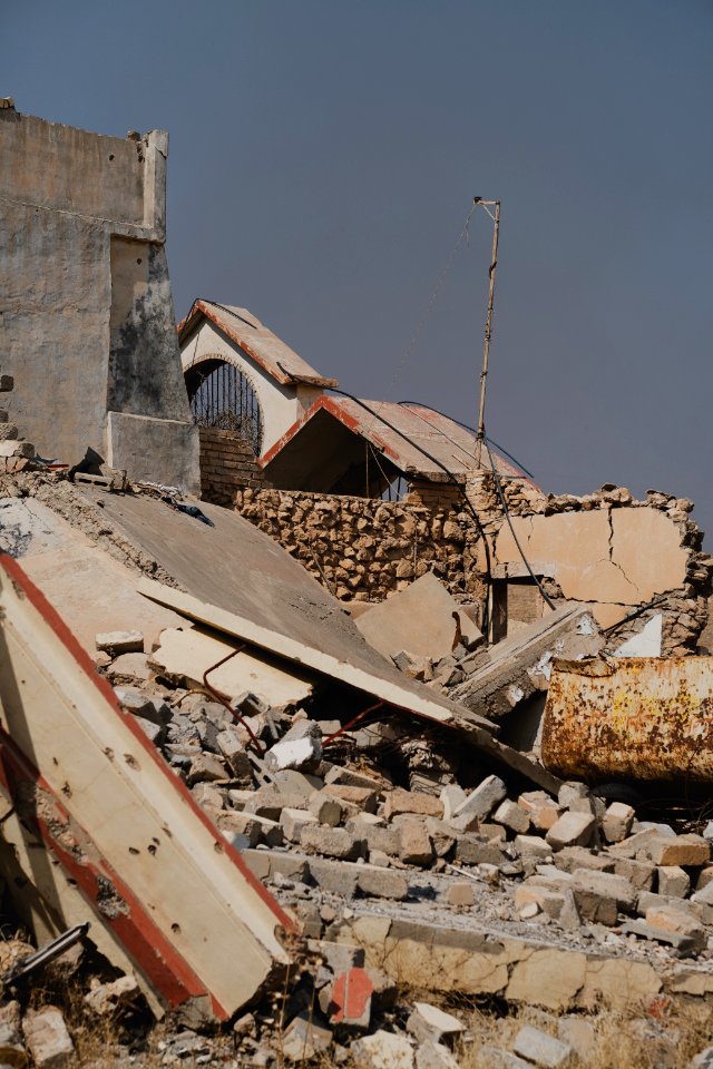 Views on 28th June 2019 of an Armenian church in the destroyed city center of Shingal while a field fire rages south of the city 02