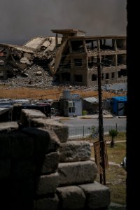 Views on 28th June 2019 around the destroyed city center of Shingal while a field fire rages south of the city 19