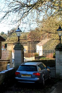 Wall With Stone Pier Supporting Lamp Bracket