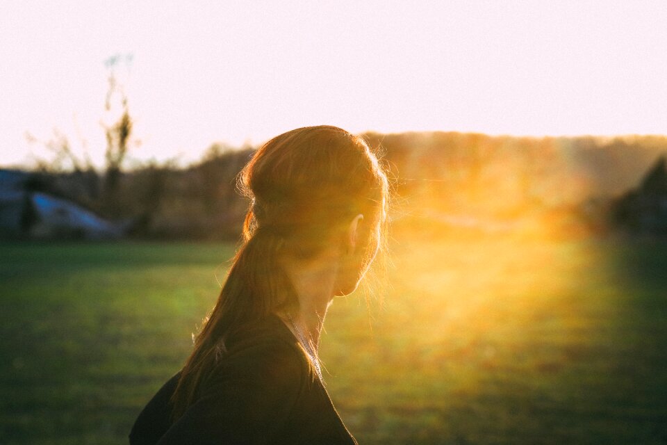 Woman sunset green
