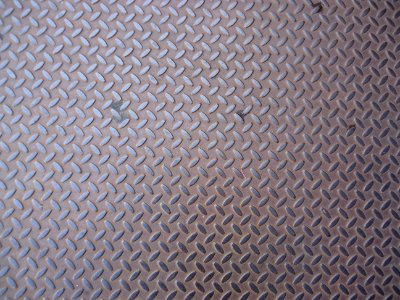 Surfaces metal pattern on door to basement photo
