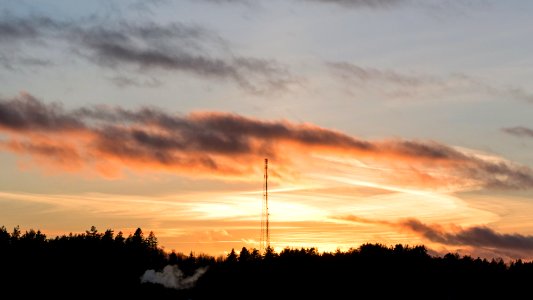 Sunset behind telecommunications mast photo