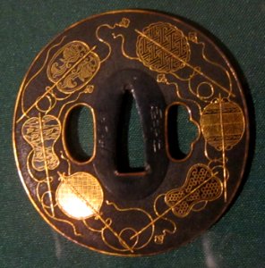 Sword guard (tsuba) with gold fans by Kusakari Kiyosada I