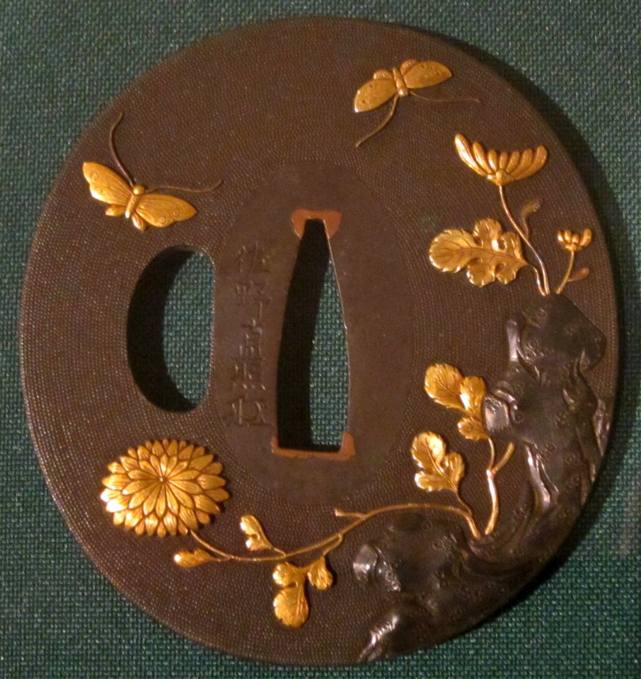 Sword guard (tsuba) with butterflies and chrysanthemums by Sano Naoteru