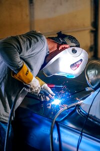Welder welding blue work