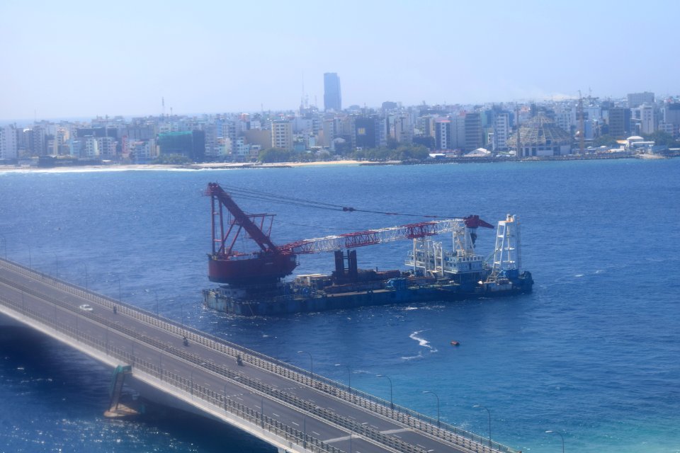Sinamalé Bridge, barge, and mosque under construction