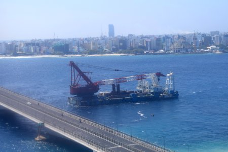 Sinamalé Bridge, barge, and mosque under construction