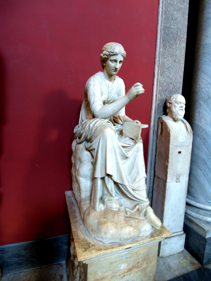 Statue of a female reading in the vatican museum