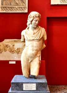 Statue of a youth wearing a chlamys and pilos, 2nd cent. A.D
