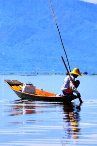Wooden water fisherman photo