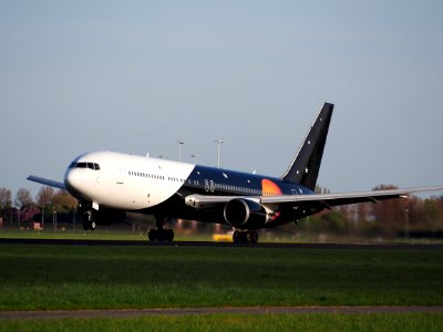 Titan Airways G-POWD Boeing 767 takeoff from Polderbaan, Schiphol (AMS - EHAM) at sunset, pic1