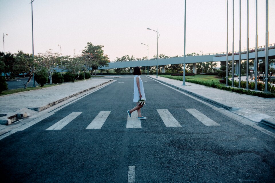 People walk sidewalk