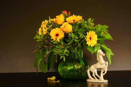 Rose yellow gerbera yellow glass vase green photo