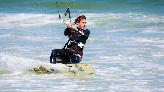 Kite-surfing female action photo