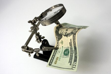 Cash magnifying glass welder