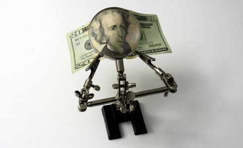 Cash magnifying glass welder