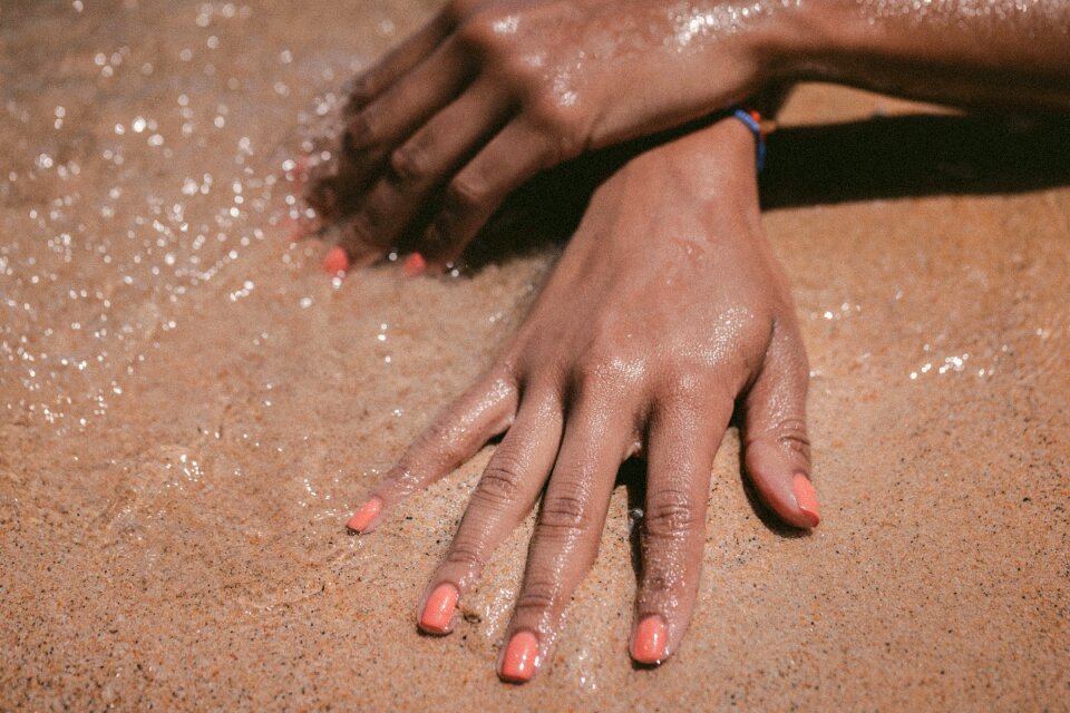 Sand suntan hand
