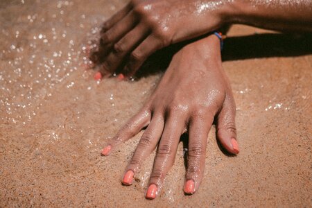 Sand suntan hand photo