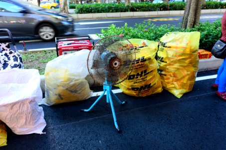 Household Fan and Joss Paper Bags under Ghost Festival Tent 20160814 photo