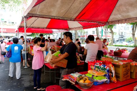 Neighbors Take away Offering Boxes after Ghost Festival 20150822