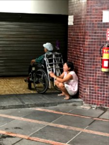 Foreign Care-Giver Using Mobile phone in Central Court of Shin Kong Minsheng Square 20171015 photo
