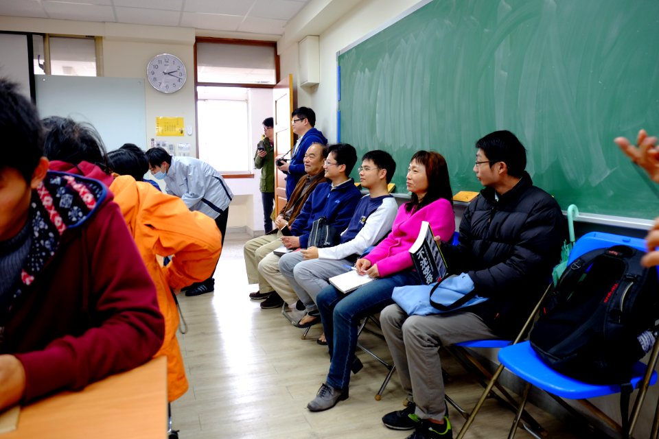 Guests Sitting on Seats in Rear Section of Meeting Room 20151230