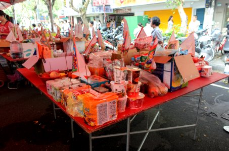 Offering Items on Table with Triangle Flags in 2015 Ghost Festival of Futai Village 20150822b