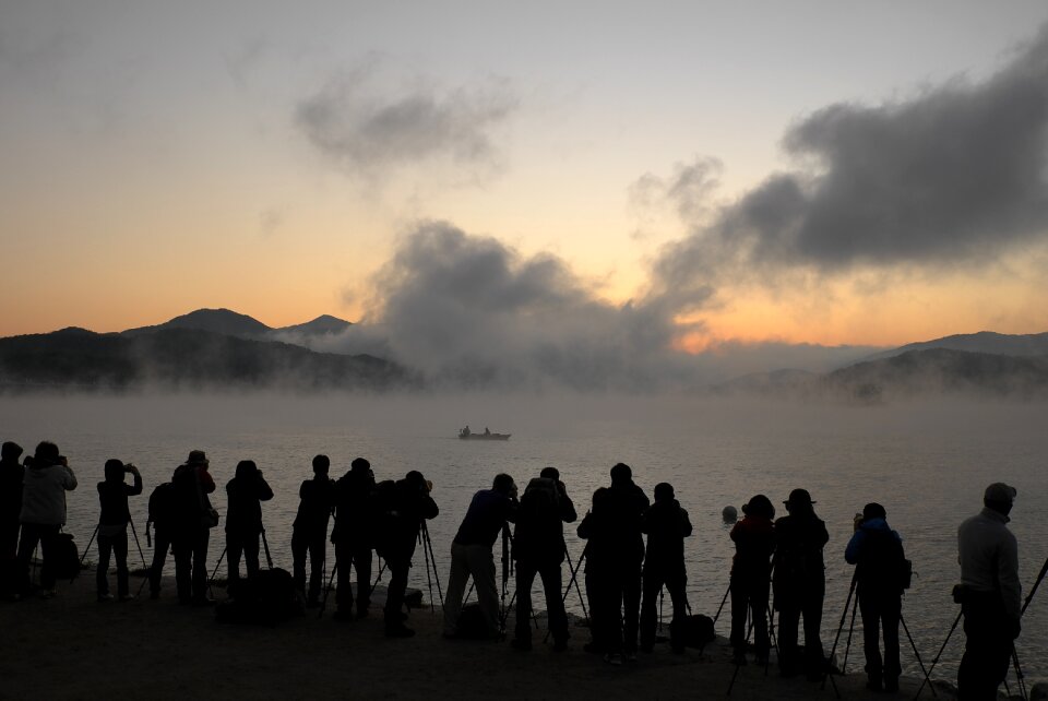 Dawn water mist people