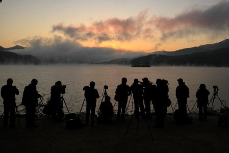 Dawn water mist people