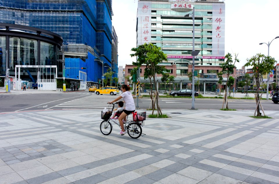 Mother and Child Riding Bicycle on Sidewalk of Songshan Road 20141004