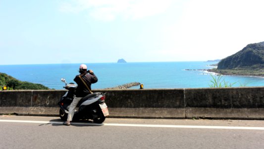 Motorcycle Rider Photographing Coast at Keelung-Jinshan Highway in Anle District, Keelung 20170324 photo