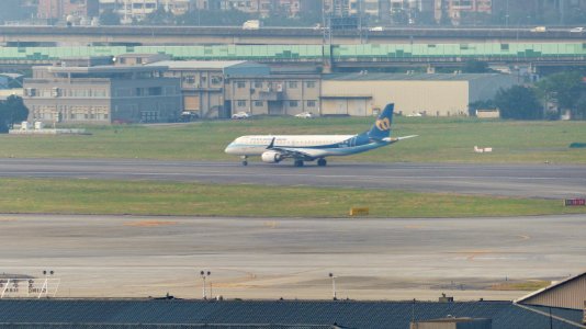 Mandarin Airlines Embraer 190 B-16823 Taking off from Taipei Songshan Airport 20141031
