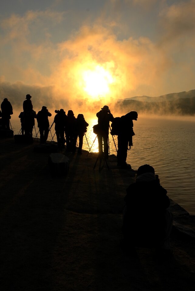 Dawn water mist people