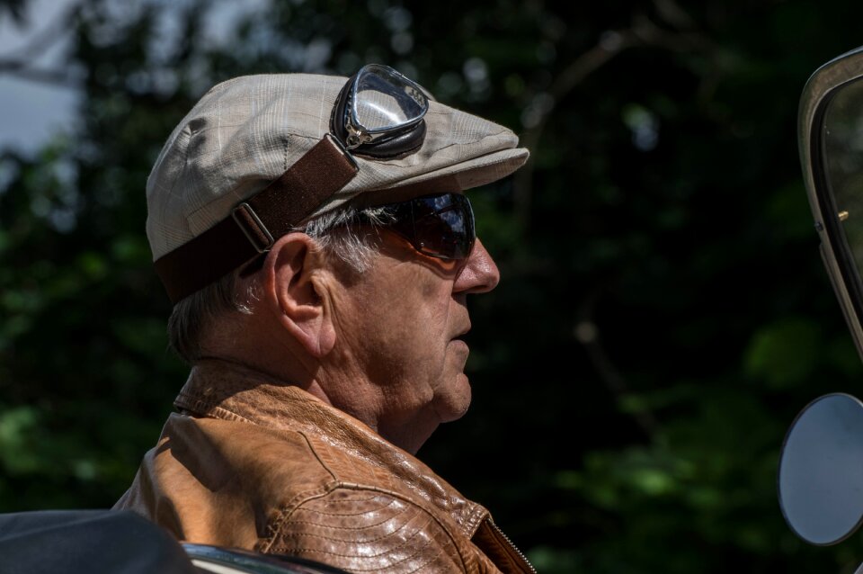 Senior classic car driver flat cap
