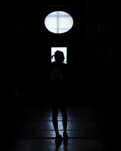 Girl indoor dark photo