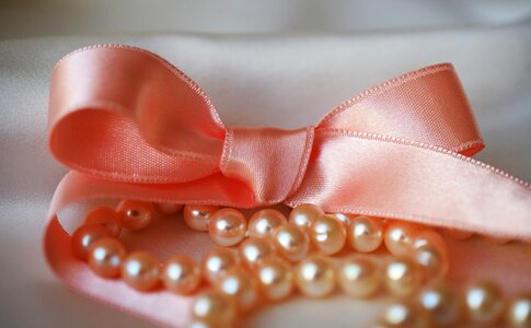 White pink ribbon closeup photo