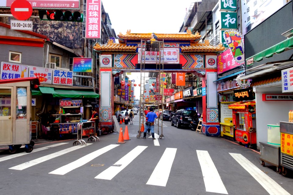 Cleaning Worker Wipping Sign of Raohe Street Night Market 20161031 photo