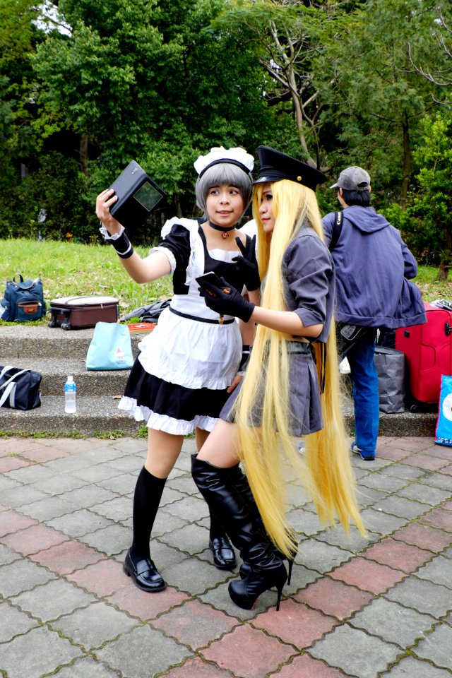 Cosplayer of Bishamonten with other one Watching Mobile Phone 20150228