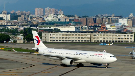China Eastern Airlines Airbus A330-243 B-6128 Taxiing at Taipei Songshan Airport Apron 20160821b