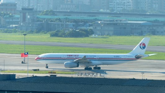 China Eastern Airlines Airbus A330-343X B-6083 Taxiing at Taipei Songshan Airport Apron 20140729
