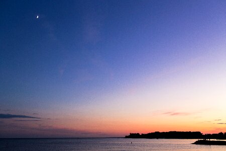 Moon silhouette lake photo