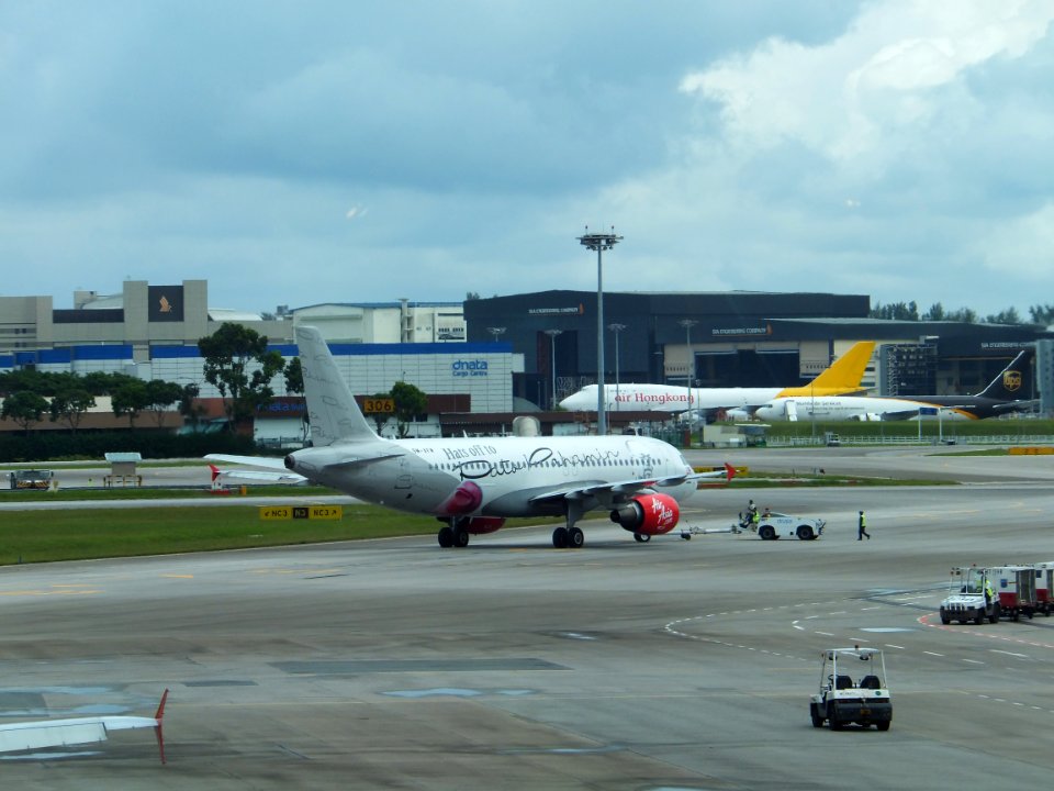 AirAsia Airbus A320-216 9M-AFM Leaving Apron by Tractor in Singapore Changi Airport 20130211