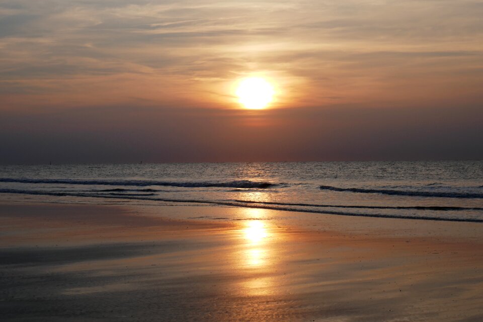 Sunset sea water clouds