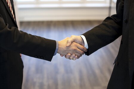 Trust arrangement shaking hands